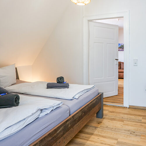 Schlafzimmer mit 1 x Doppelbett - Wohnung 8