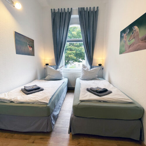 Schlafzimmer mit 2 Einzelbetten - Wohnung 1