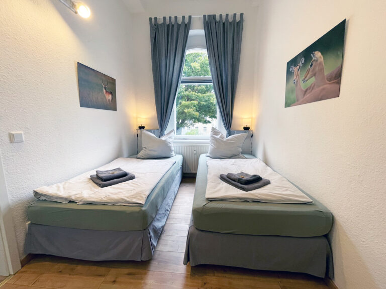 Schlafzimmer mit 2 Einzelbetten - Wohnung 1