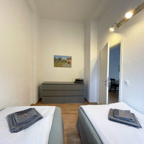Schlafzimmer mit 2 Einzelbetten - Wohnung 1