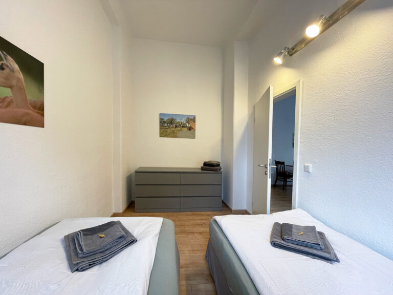 Schlafzimmer mit 2 Einzelbetten - Wohnung 1